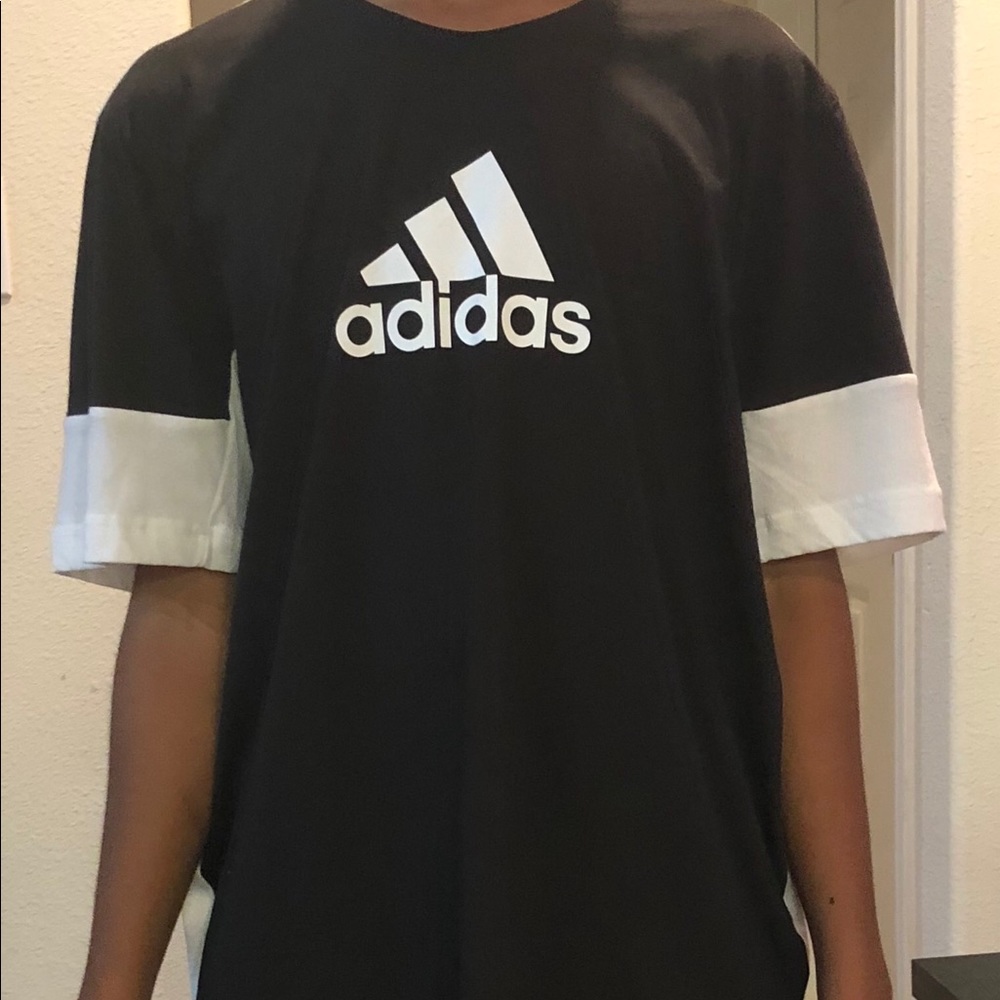 Adidas black and white two fabric Tee.